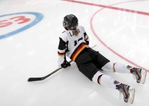 Germany's Andrea Lanzl #15  stretches before facing off against Team Russia during preliminary round action at the 2013 IIHF Ice Hockey Women's World Championship. (Photo by Jana Chytilova/HHOF-IIHF Images)