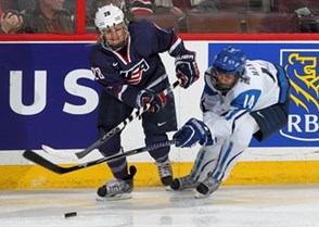 KANATA, CANADA - APRIL 8: USA's Amanda Kessel #28 and Finland's Niina Makinen #14 battle for the puck during semifinal round action at the 2013 IIHF Ice Hockey Women's World Championship. (Photo by Andre Ringuette/HHOF-IIHF Images)