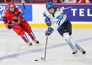KANATA, CANADA - APRIL 8: Finland's Nina Tikkinen #23 skates with the puck while Russia's Alexandra Kapustina #44 chases her down during bronze medal game action at the 2013 IIHF Ice Hockey Women's World Championship. (Photo by Andre Ringuette/HHOF-IIHF Images)